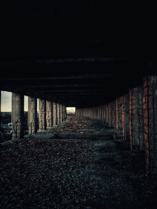 Dark corridor of abandoned city building