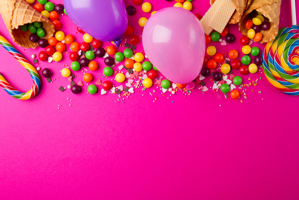 Party Accessories and Cadies on Bright Pink Background